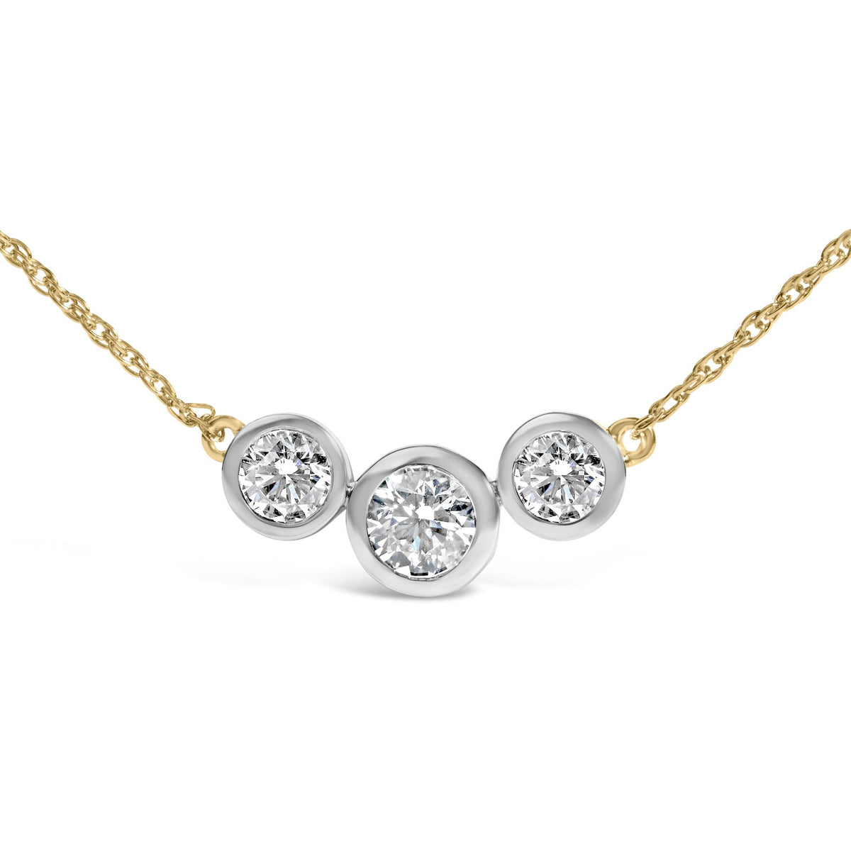Close-up front angle of a yellow metal necklace with three round white gemstones in bezel settings, with the center gemstone larger than the two on the sides.