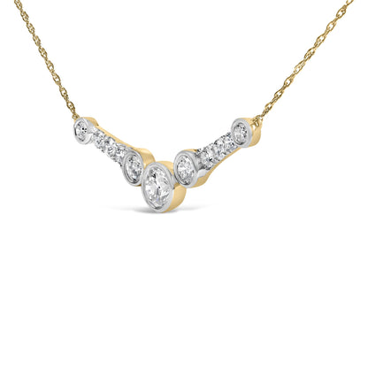 Close-up front angle of a yellow metal necklace with a curved pendant featuring multiple round white gemstones in bezel and prong settings along the pendant.