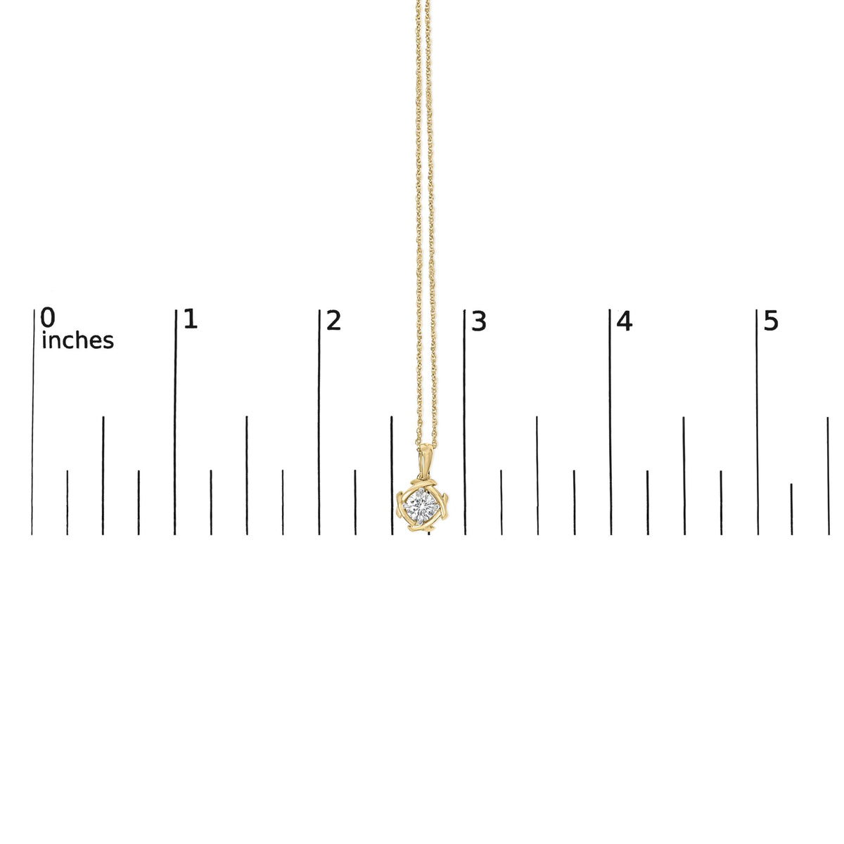 Yellow metal chain necklace with a round white gemstone in a prong setting, shown hanging vertically on a measurement scale, front view.