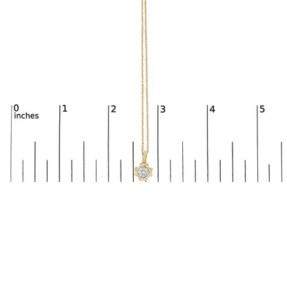 Yellow metal chain necklace with a round white gemstone in a prong setting, shown hanging vertically on a measurement scale, front view.