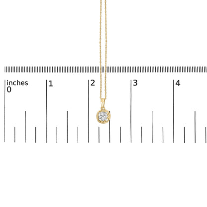 Yellow necklace with a round white gemstone in prong setting, shown on a ruler for scale, photographed from the front.