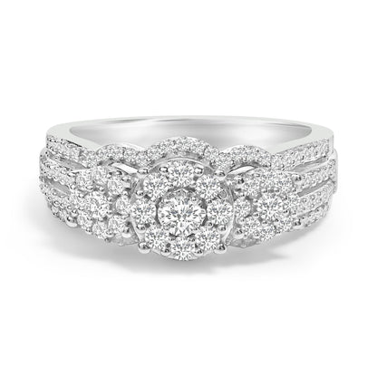 Front-facing close-up of a white metal ring featuring a round prong-set white gemstone in the center, surrounded by multiple smaller round prong-set white gemstones in a decorative cluster pattern. The band is adorned with rows of small round prong-set white gemstones.