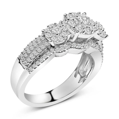 Close-up angle of a white metal ring featuring a triple round cluster of prong-set white gemstones, with additional rows of smaller white gemstones set along the band.