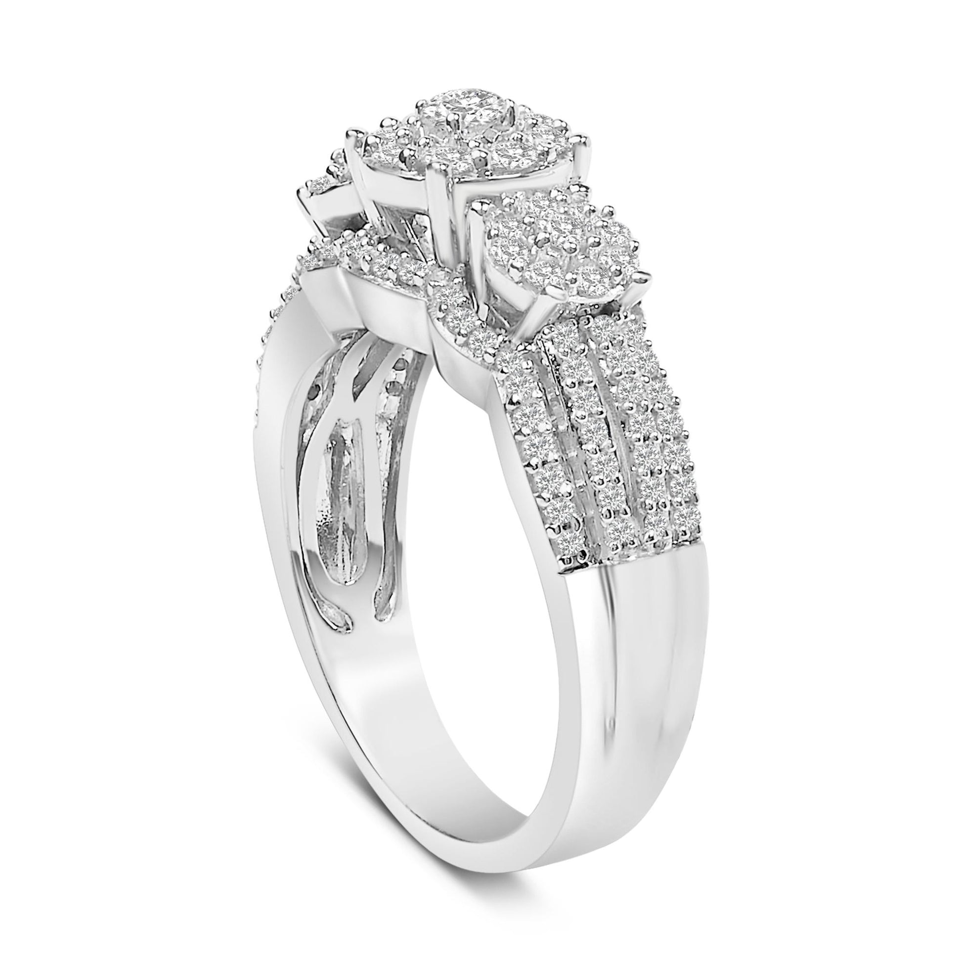 White metal ring with three raised round clusters of white gemstones and multiple rows of smaller white gemstones along the band, shown at a slight angle.