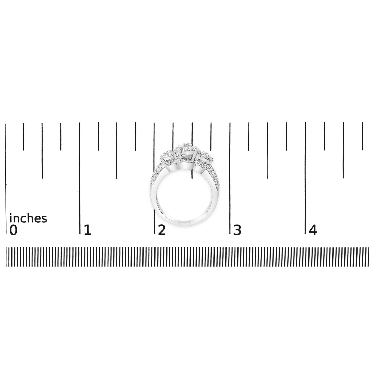 White ring with three raised round white gemstones in prong settings, surrounded by smaller round white gemstones on the band, shown on a scale from a top-down angle.