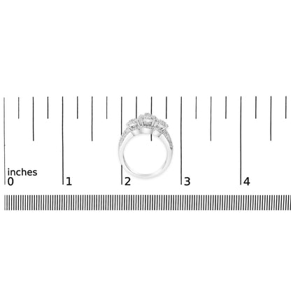 White ring with three raised round white gemstones in prong settings, surrounded by smaller round white gemstones on the band, shown on a scale from a top-down angle.