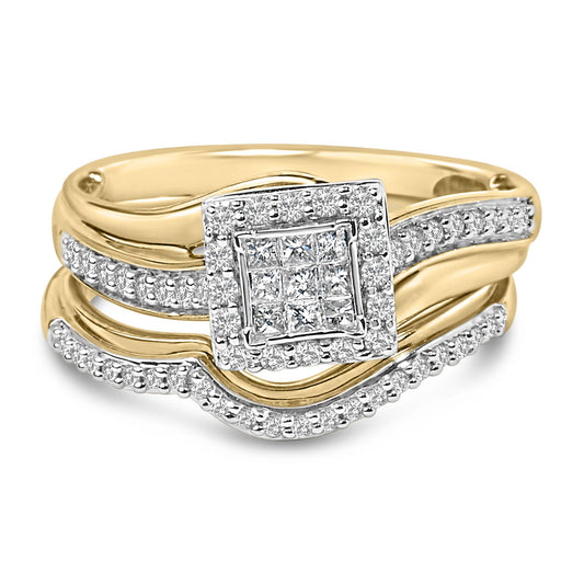 Close-up front angle of a yellow and white metal ring featuring a square cluster of princess-shaped white gemstones in an invisible setting, surrounded by round white gemstones in a shared prong setting along the band.