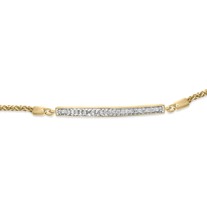 Close-up front view of a yellow metal bracelet featuring a horizontal bar with pave-set white round gemstones, shown on a white background.