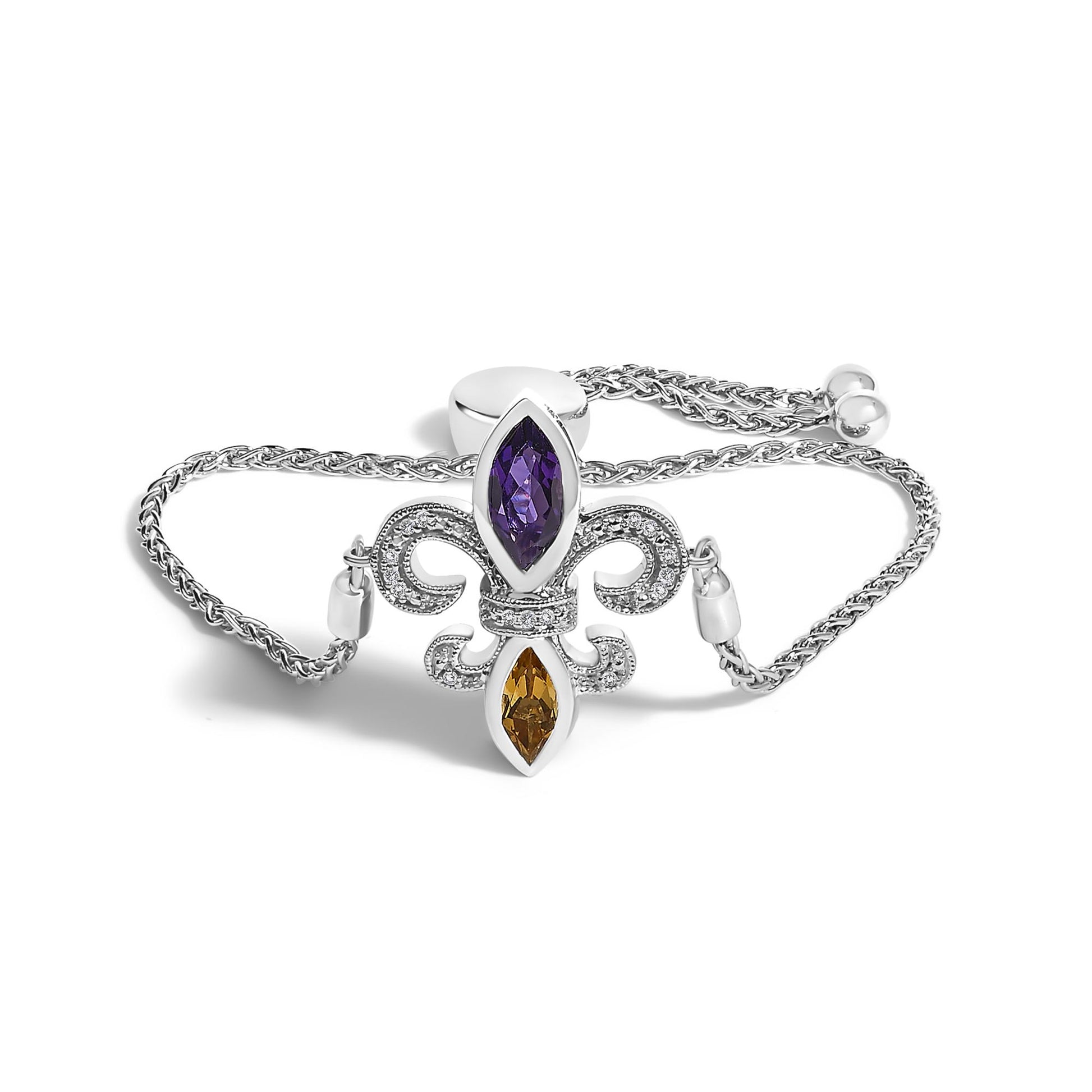 White metal bracelet with a fleur-de-lis centerpiece featuring white pave-set round gemstones, a purple marquise-shaped gemstone at the top, and an orange marquise-shaped gemstone at the bottom, shown from a front angle on a white background.