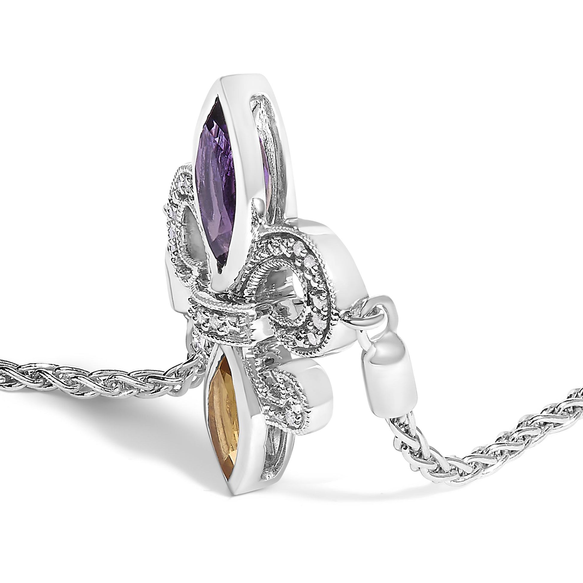 Close-up side angle of a white metal bracelet featuring a bow design accented with white round gemstones in pave setting, one purple marquise gemstone, and one orange marquise gemstone, on a woven chain.