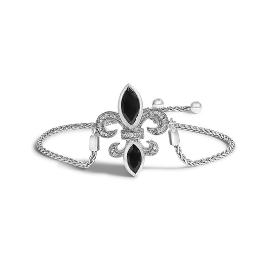 White metal bracelet with two black marquise-shaped gemstones set in bezel settings and surrounding white round gemstones in pave setting, shown from front angle.