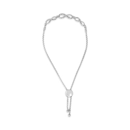 White metal bracelet with twisted chain and curved links accented with pave-set white gemstones, shown in a close-up top view.