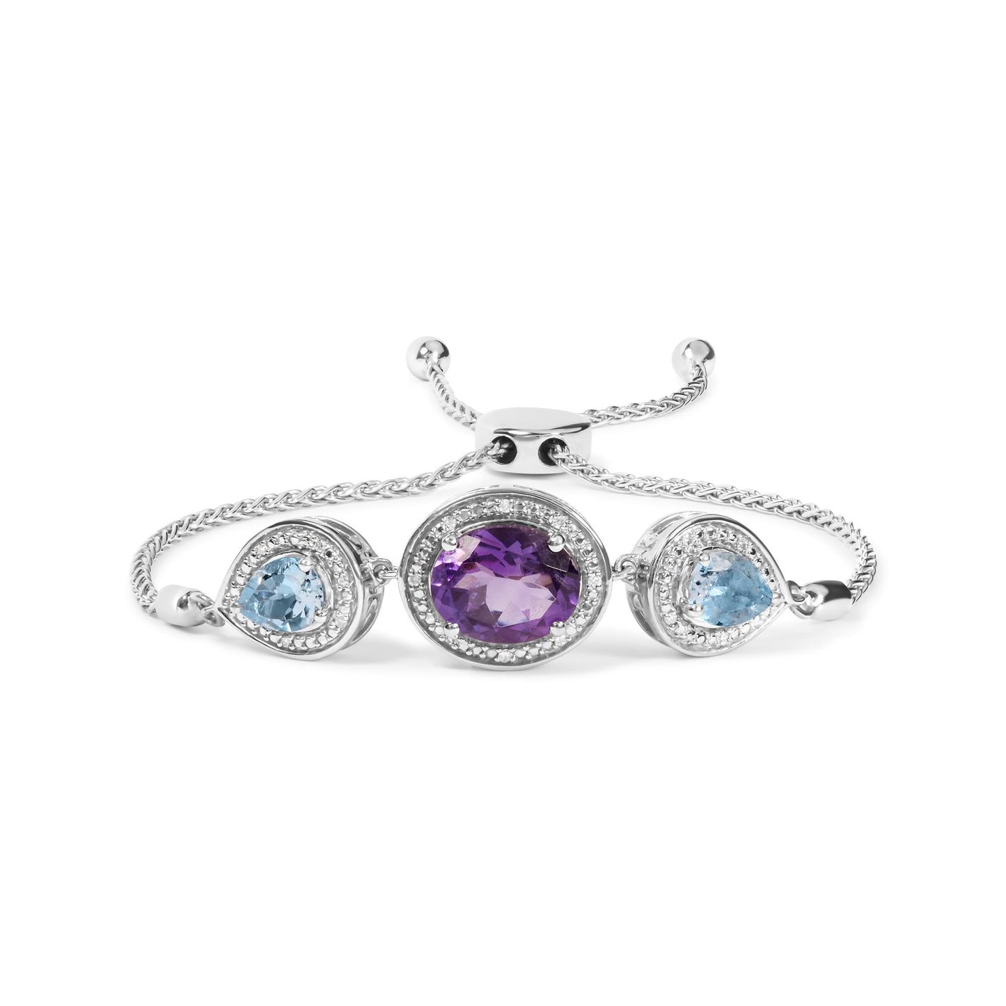 White bracelet with a central oval purple gemstone and two pear-shaped blue gemstones on either side, all surrounded by small round white gemstones, shown in a front-facing angle.