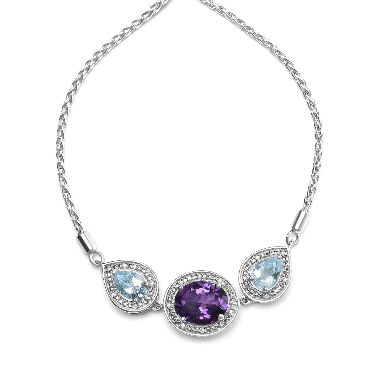 White metal bracelet with a central oval purple gemstone and two pear-shaped blue gemstones on either side, each surrounded by small round white gemstones, shown in a flat lay front angle.