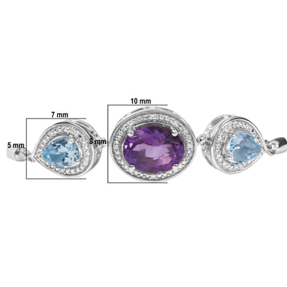 Close-up front angle of a white metal bracelet featuring a central oval purple gemstone surrounded by small round white gemstones, flanked by two pear-shaped blue gemstones each also bordered by small round white gemstones.