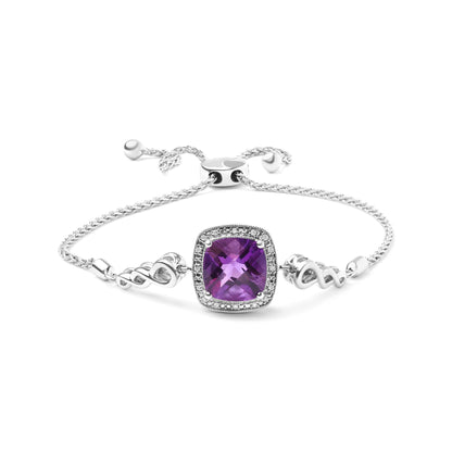 White metal bracelet with a central purple cushion-shaped gemstone surrounded by small round white gemstones, shown in a front-facing close-up angle.