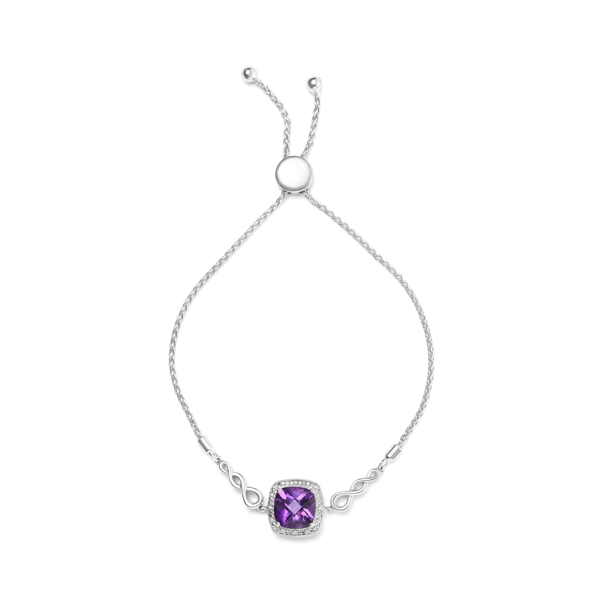 White metal bracelet with a cushion-shaped purple gemstone centerpiece surrounded by small round white gemstones, photographed from above on a white background.