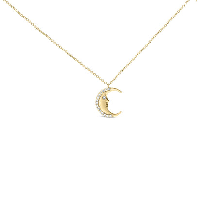 Yellow metal necklace with crescent moon pendant featuring a face and white round gemstones along the outer edge, shown from the front on a white background.
