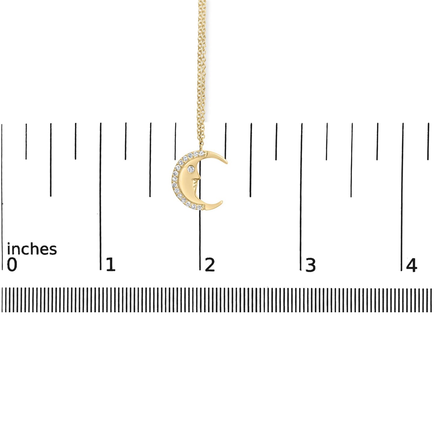 Yellow necklace with a crescent moon pendant featuring white round gemstones along the outer curve, shown hanging against a ruler for size reference, front-facing angle.