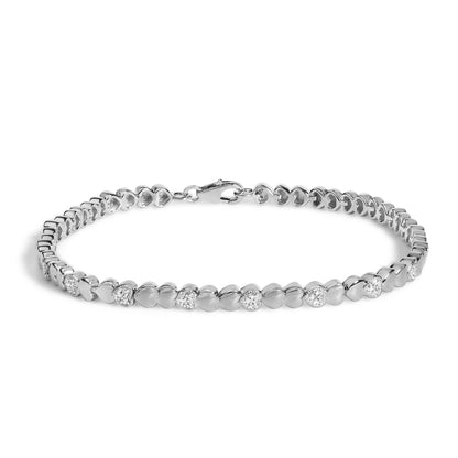 White heart-shaped link bracelet with alternating links featuring pave-set round white gemstones, shown flat on a white background from a top front angle.