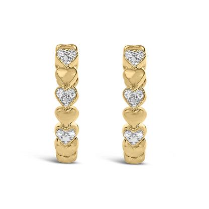 Front view of gold vermeil mini heart hoop earrings featuring smooth and diamond-accent hearts on white
