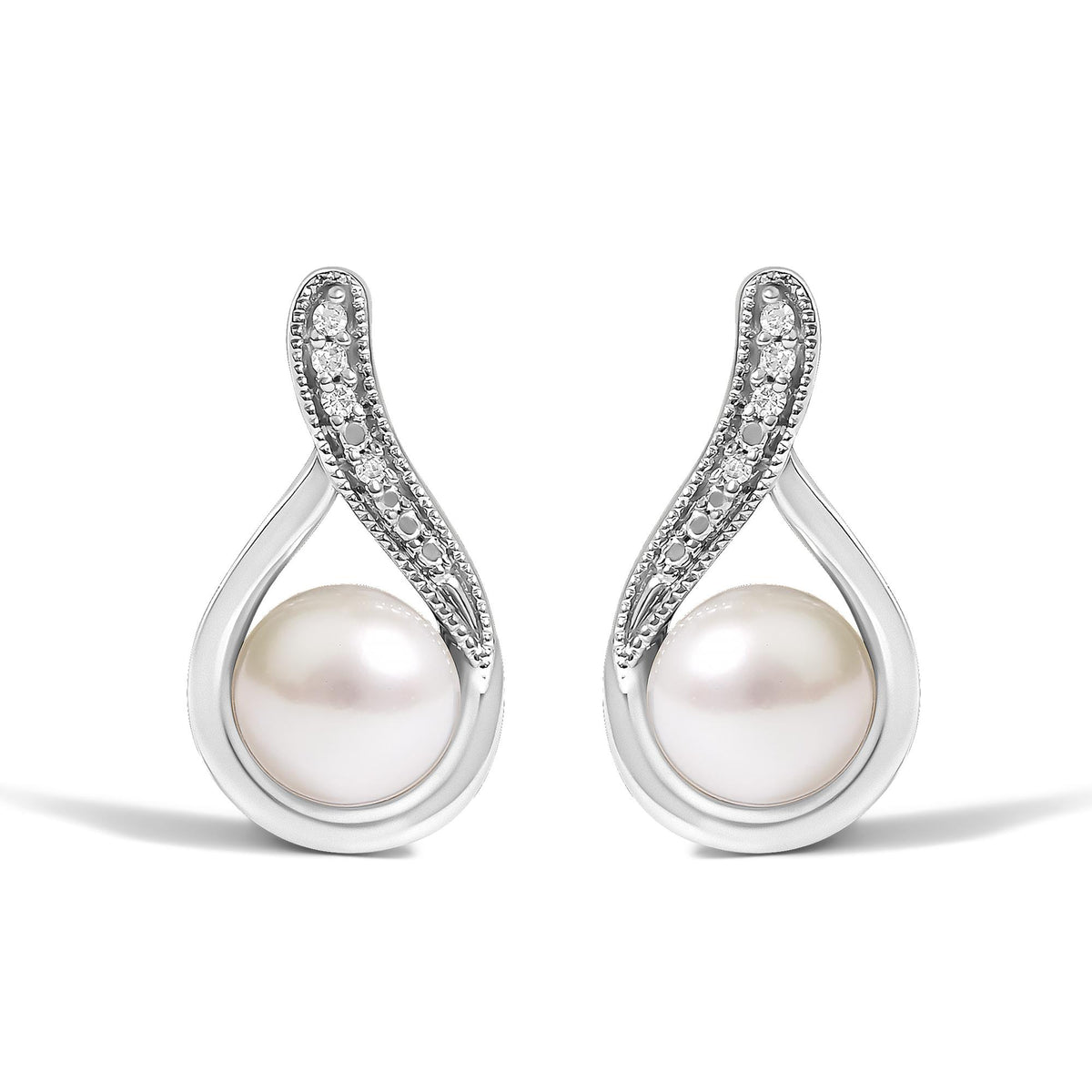 Close-up front view of a pair of white metal earrings featuring a white gemstone at the bottom and a curved section adorned with small round white gemstones in a pave setting.