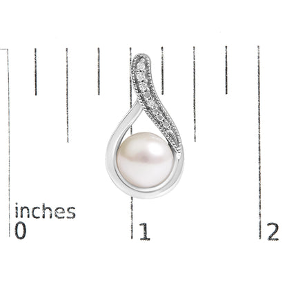Close-up image of a white metal earring with an oval-shaped design featuring a large white gemstone at the bottom and a curved top section adorned with small round white gemstones in a pave setting, shown on a scale with inch markings.