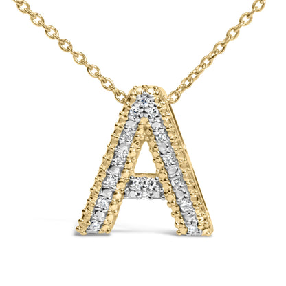 Close-up front angle of a yellow metal necklace pendant in the shape of the letter 'A' with white gemstones set in a prong setting along the pendant edges.