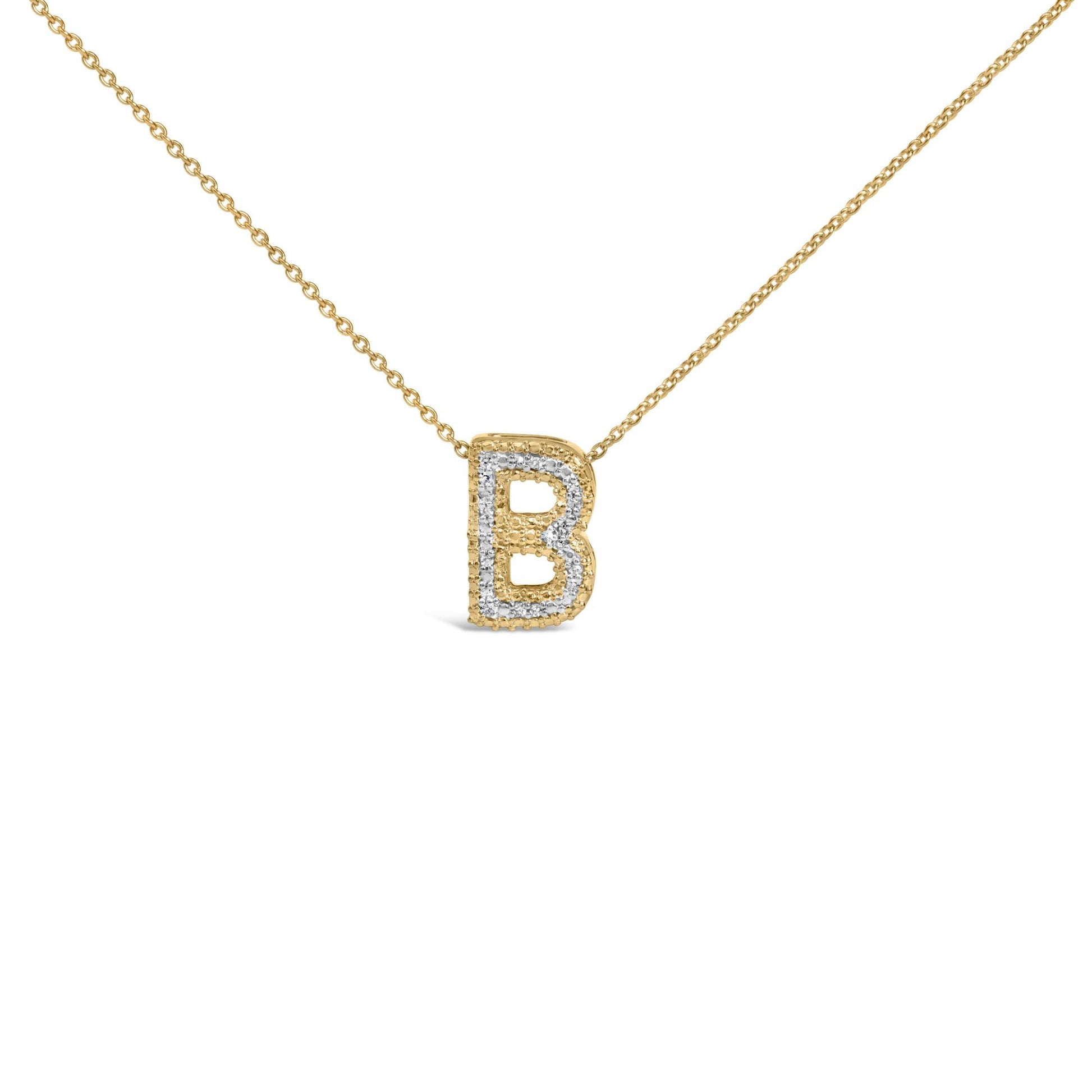 Close-up front view of a yellow metal necklace with a pendant shaped like the letter B, outlined with round white gemstones in prong settings, shown on a white background.