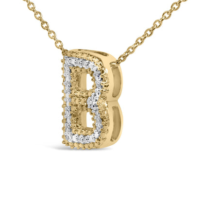 Close-up angled view of a yellow metal necklace pendant shaped like a stylized letter B, outlined with multiple small round white gemstones in prong settings, shown isolated on a white background.