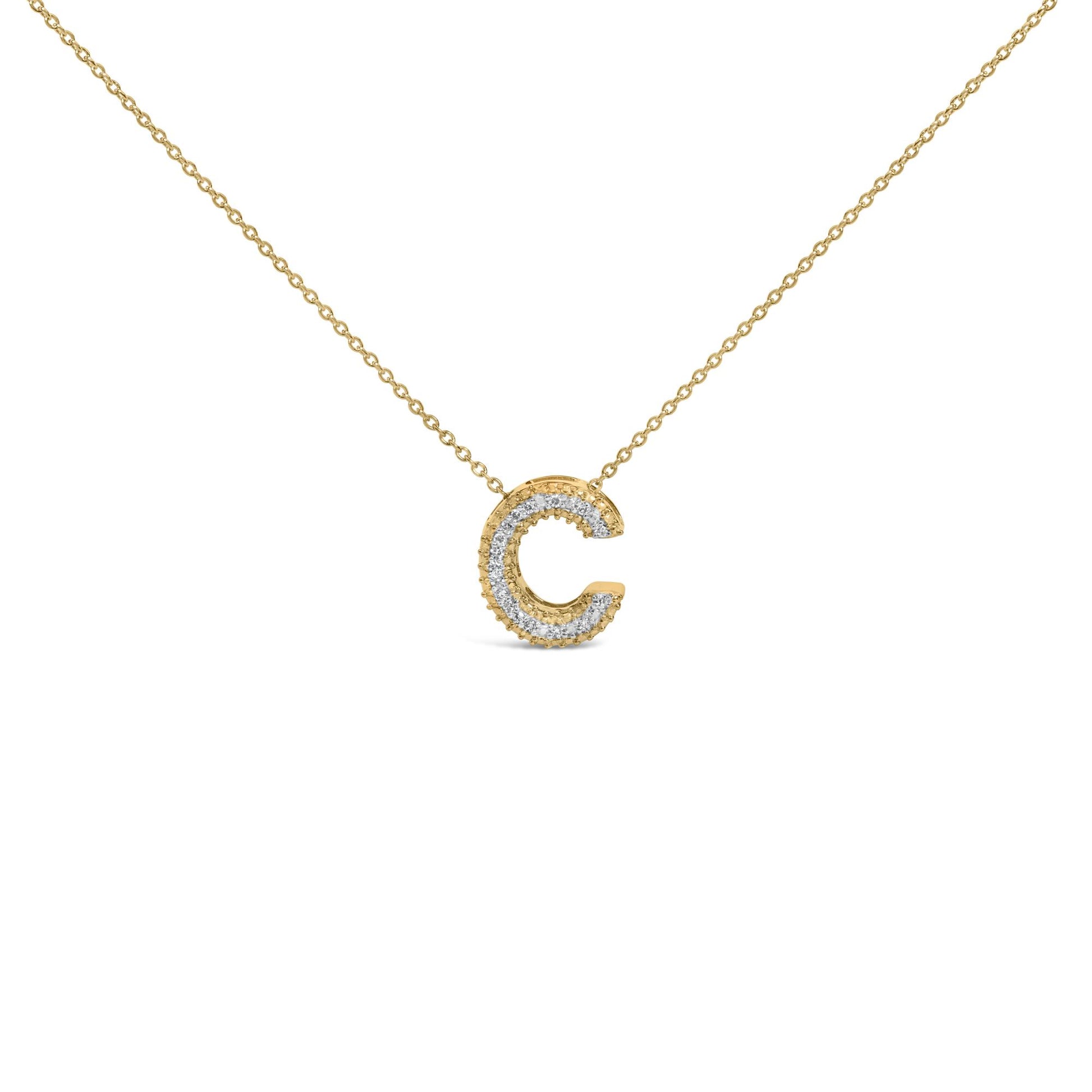 Close-up front view of a yellow metal necklace with a pendant shaped as the letter 'C' adorned with white round gemstones in a prong setting.