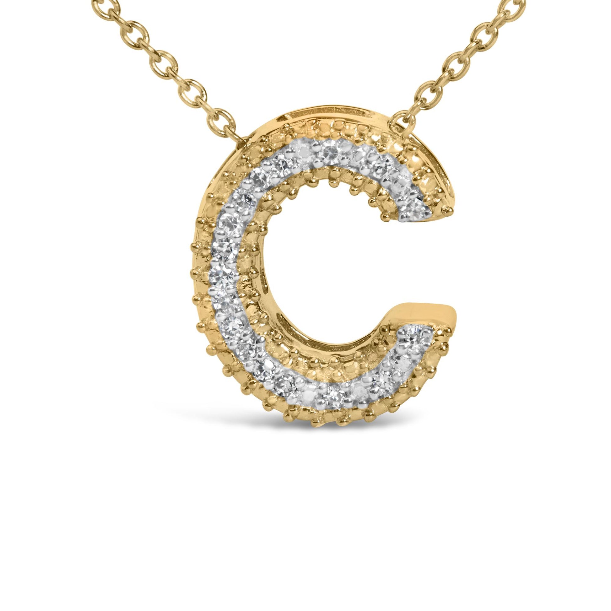 Close-up front view of a yellow metal necklace pendant shaped like the letter 'C,' featuring two rows of white round gemstones in prong settings along the outer curve.