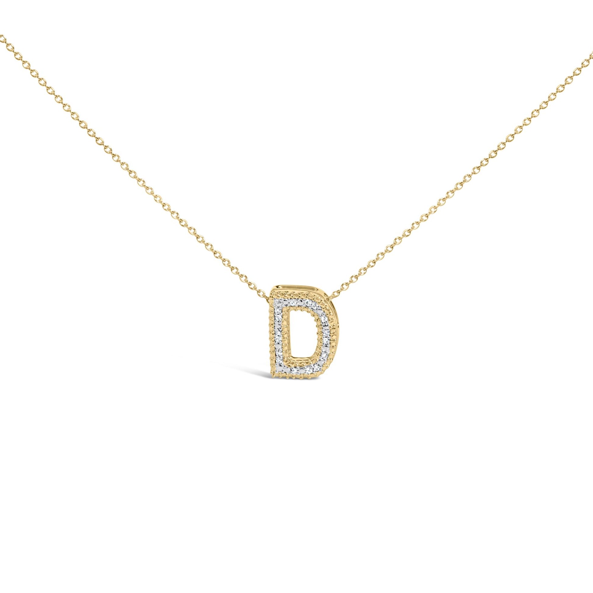 Close-up front view of a yellow metal necklace with a pendant shaped like the letter D outlined with white gemstones in prong settings.