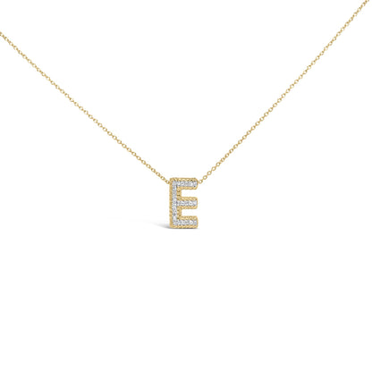 Close-up front view of a yellow metal necklace with a pendant shaped like the letter E, adorned with round white gemstones in a prong setting.