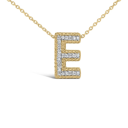 Close-up front angle of a yellow metal necklace with a pendant shaped as the letter E, featuring white round gemstones in a prong setting.