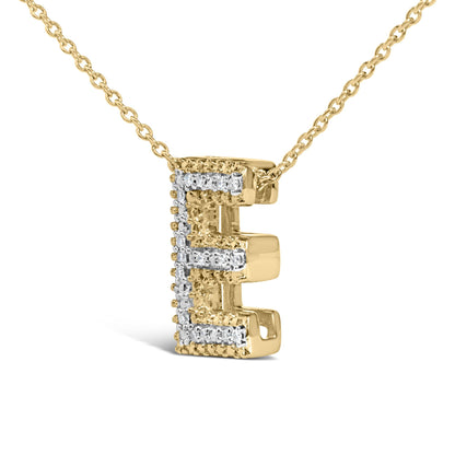 Close-up front angle of a yellow necklace featuring a letter E pendant outlined with white gemstones in prong settings.