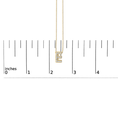 Close-up front view of a yellow necklace with an 'E' pendant encrusted with white gemstones, shown on a measurement scale.