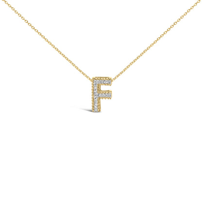 Close-up front view of a yellow metal necklace with a pendant in the shape of the letter 'F' adorned with white gemstones set in prongs, shown on a white background.