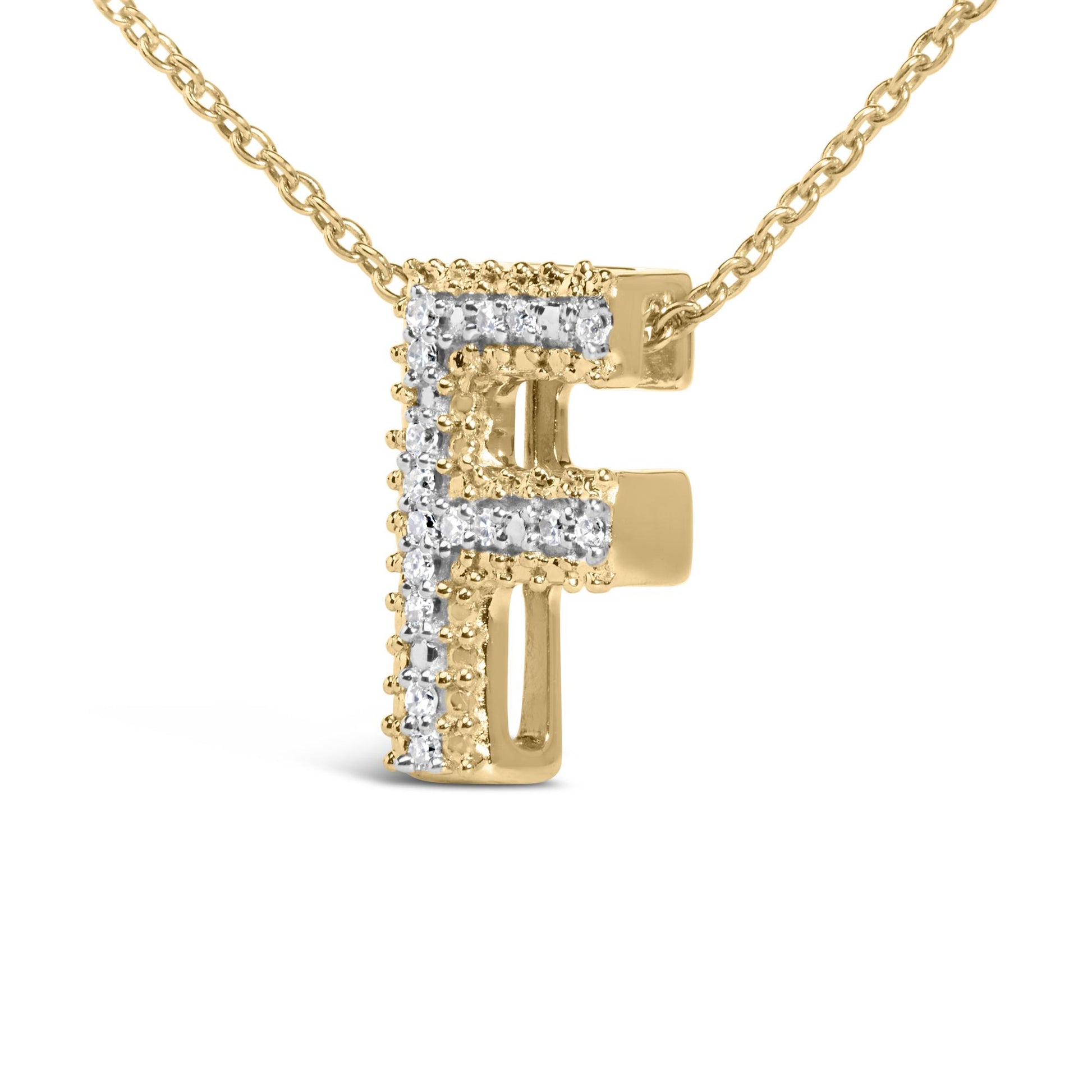Close-up front view of a yellow metal necklace pendant in the shape of the letter 'F,' accented with round white gemstones in prong settings outlining the letter.
