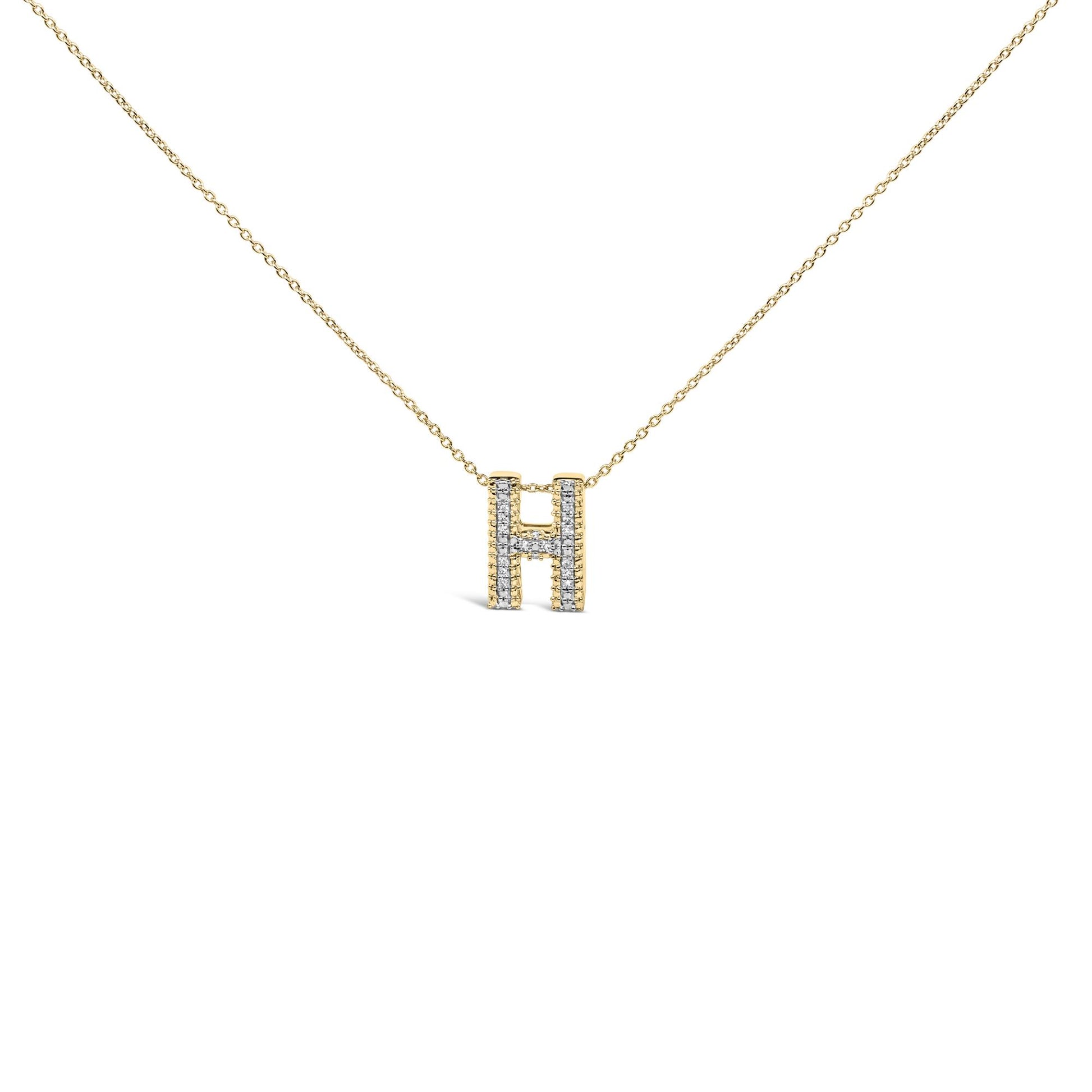 Close-up front view of a yellow necklace with a pendant shaped like the letter H, featuring white gemstones set in prong settings along the pendant.