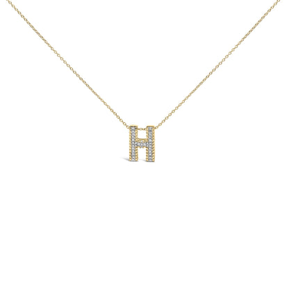 Close-up front view of a yellow necklace with a pendant shaped like the letter H, featuring white gemstones set in prong settings along the pendant.