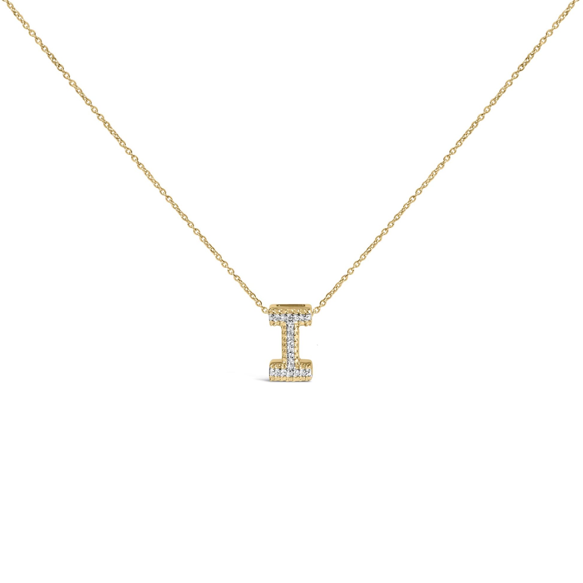 Close-up front view of a yellow necklace with a pendant shaped like the letter 'I' adorned with round white gemstones in a prong setting.