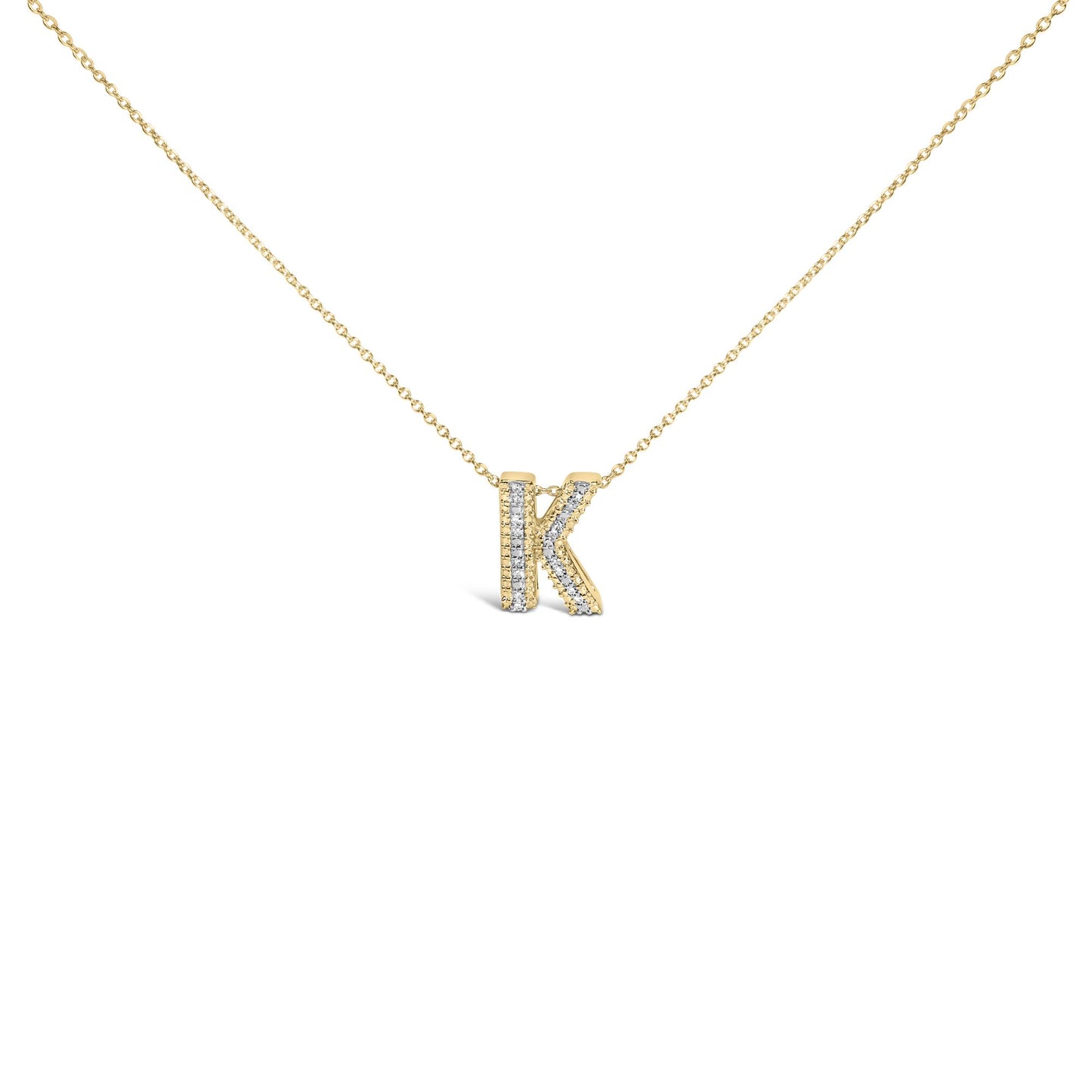 Close-up front angle of a yellow metal necklace with a pendant shaped like the letter K, adorned with round white gemstones in a prong setting on the pendant's front surface.