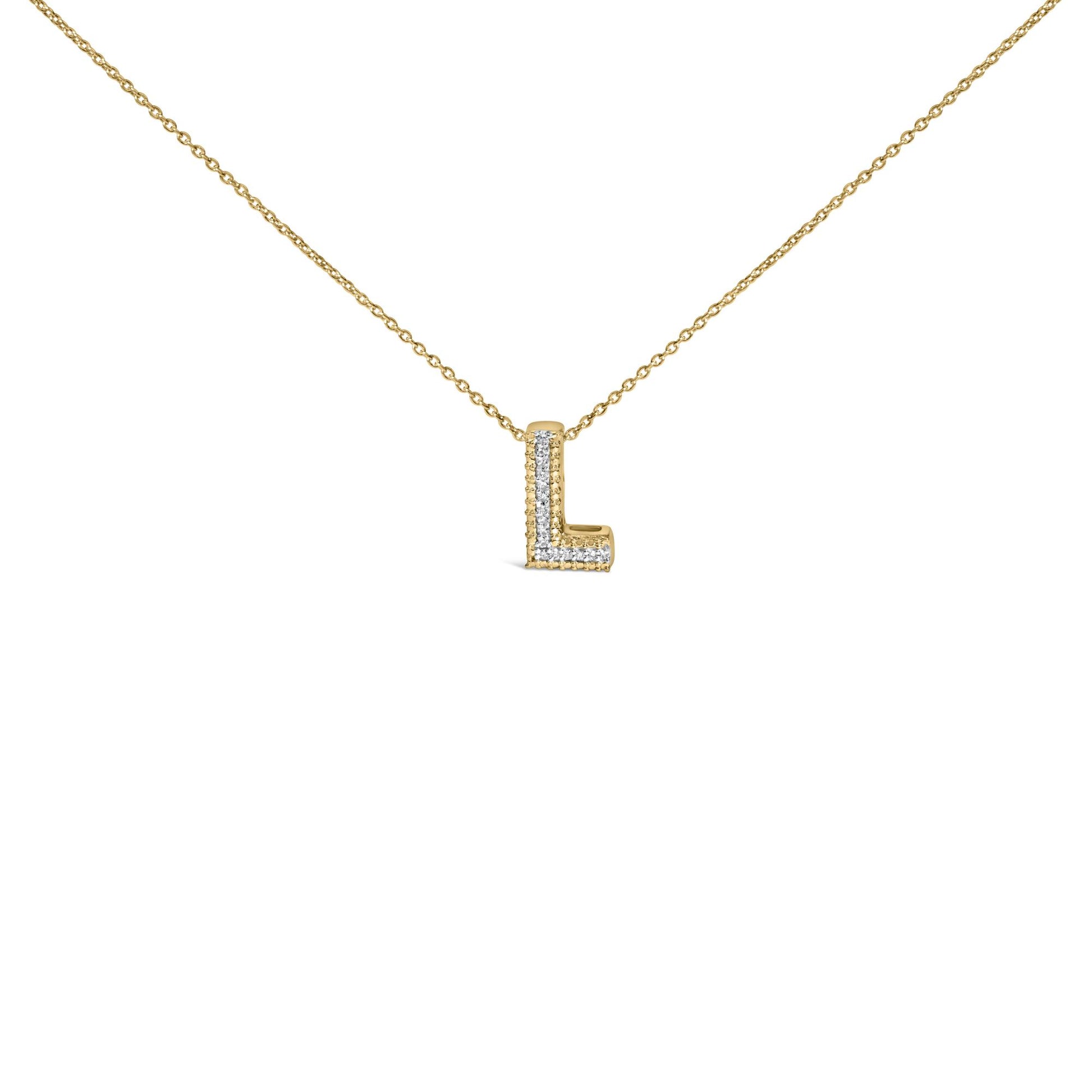 Front angle close-up of a yellow metal necklace with an L-shaped pendant featuring white gemstones set in a prong setting.