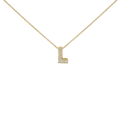 Front angle close-up of a yellow metal necklace with an L-shaped pendant featuring white gemstones set in a prong setting.