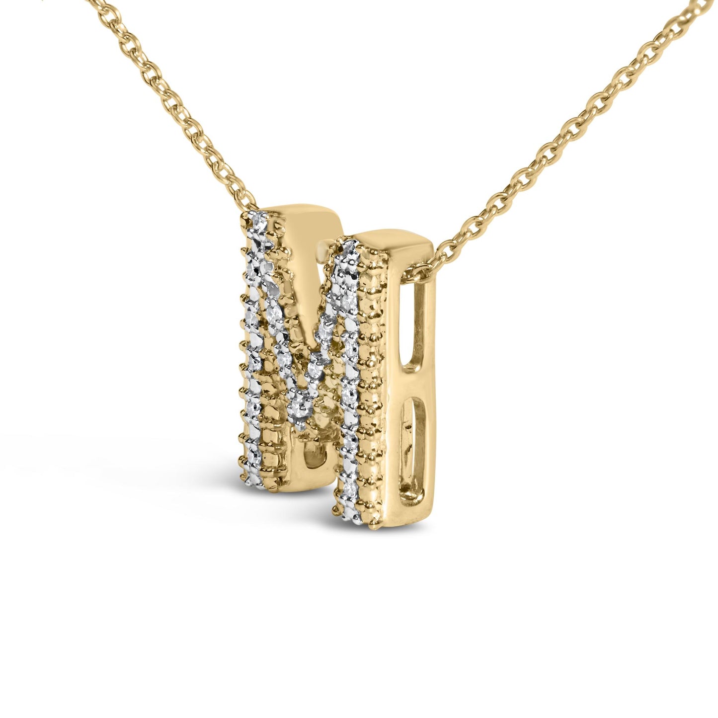 Close-up front angle of a yellow metal necklace pendant shaped like the letter 'N' adorned with multiple rows of prong-set round white gemstones, hanging from a linked chain.