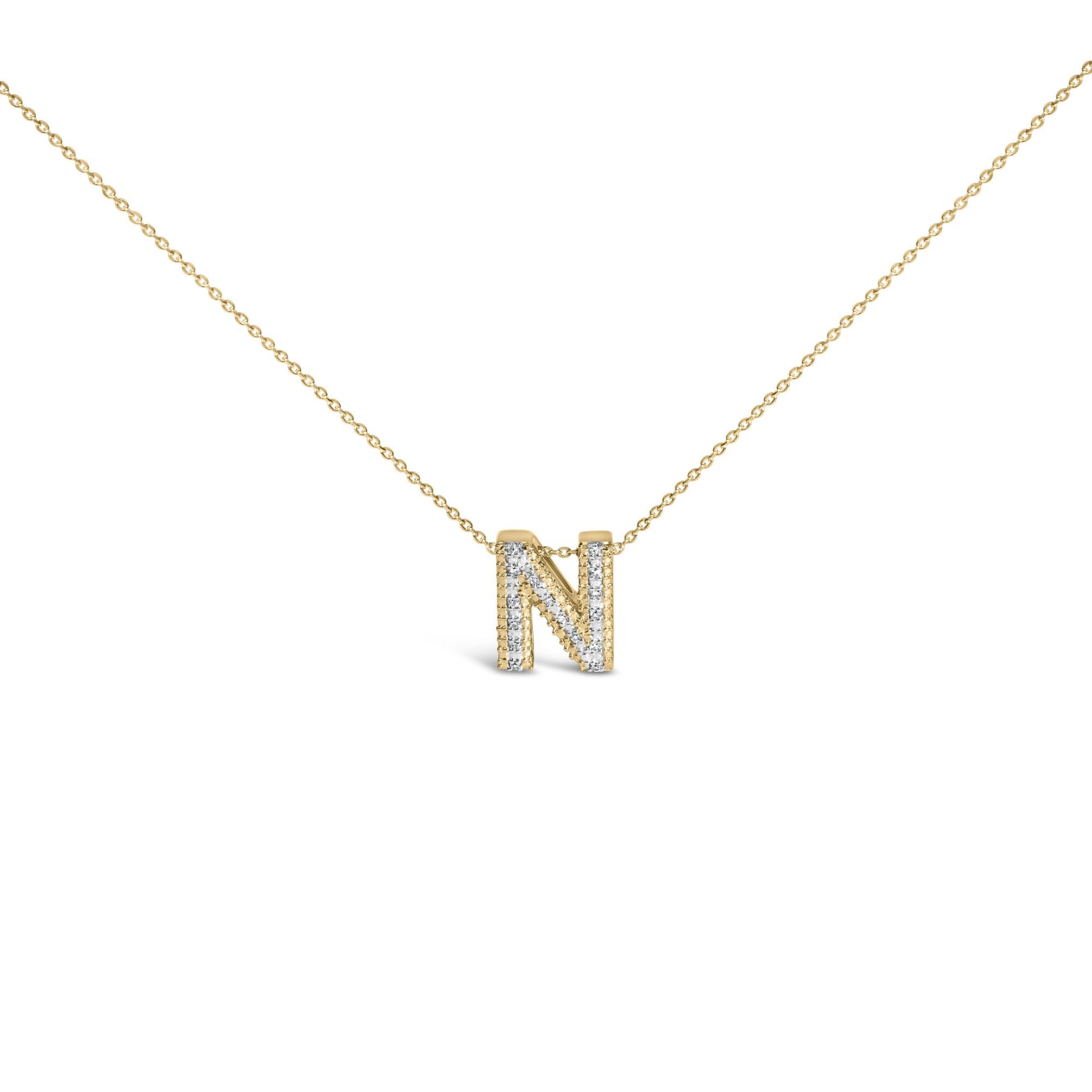 Front angle close-up of a yellow necklace chain with a pendant shaped as the letter 'N,' adorned with white round gemstones in prong settings.