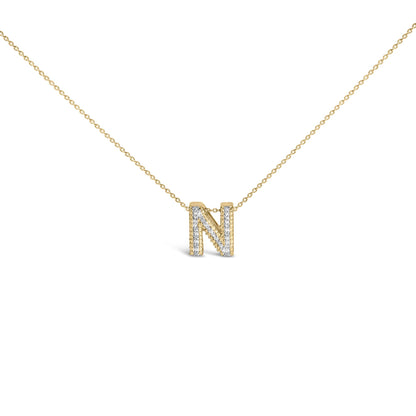 Front angle close-up of a yellow necklace chain with a pendant shaped as the letter 'N,' adorned with white round gemstones in prong settings.
