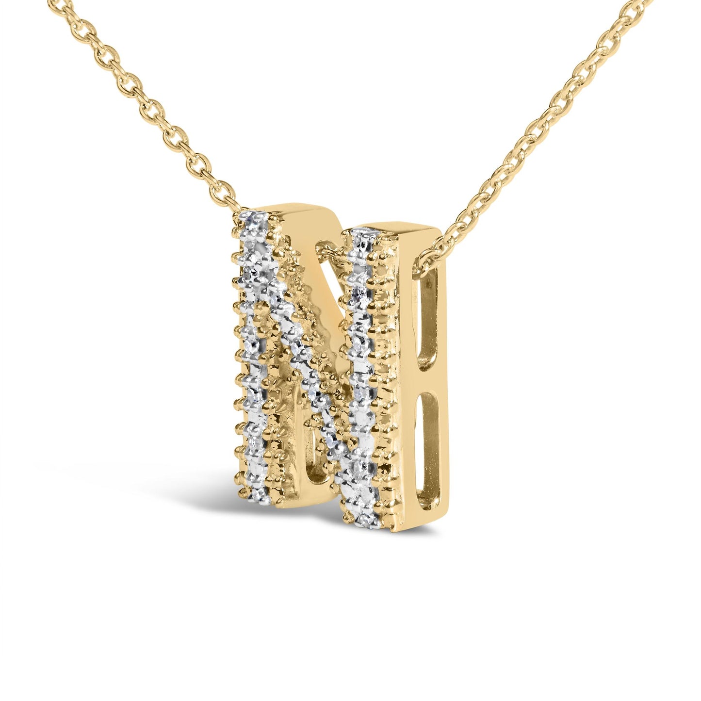 Close-up front angled view of a yellow metal necklace pendant in the shape of the letter N, adorned with rows of white gemstones set in prongs, shown on a white background.