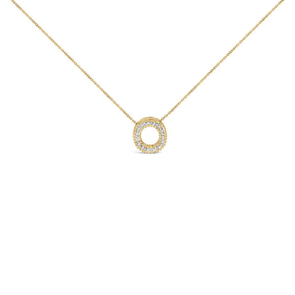 Close-up front view of a yellow metal necklace with a circular pendant encrusted with white gemstones in a prong setting, photographed against a white background.